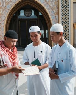 Open Quran on a book stand for Hifz memorization revision
