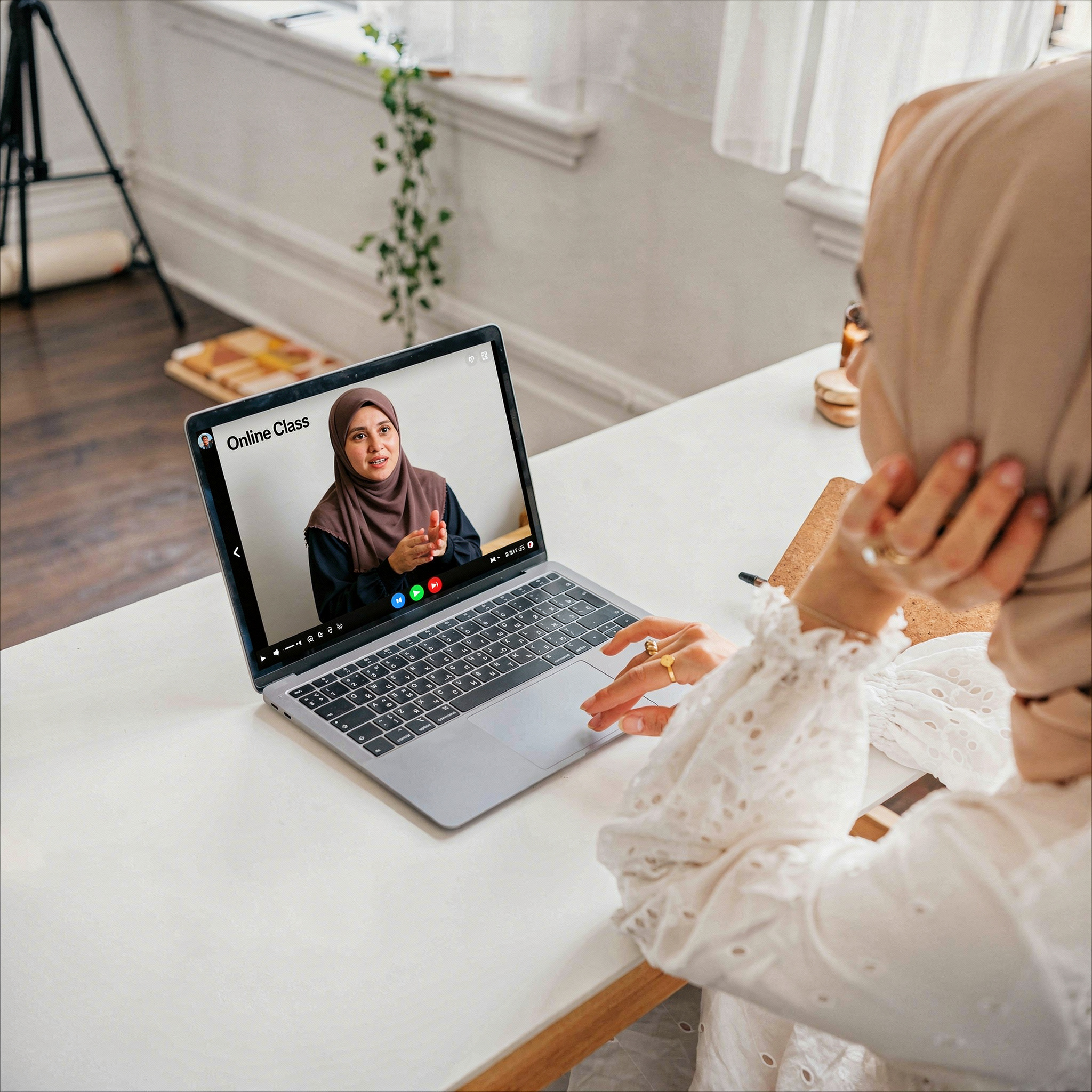 Adult Muslim woman in hijab studying