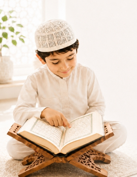 Muslim kid learning Quran