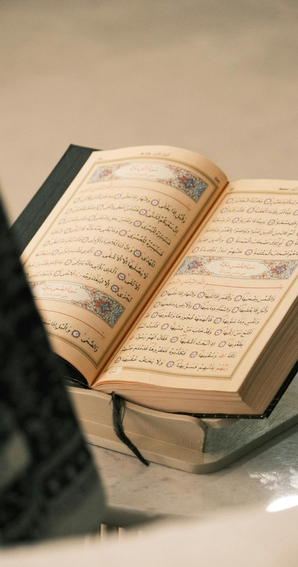 Holy Quran book open on stand